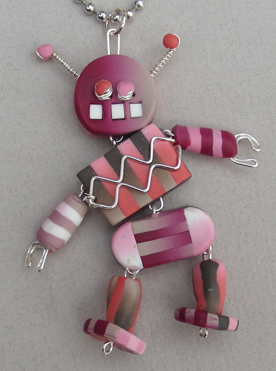image of toothy, dancing robot, handmade from colored polymer clay and stainless wire
