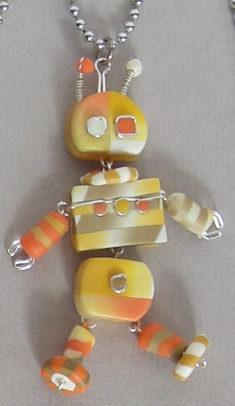 image of dancing robot, handmade from colored polymer clay and stainless wire